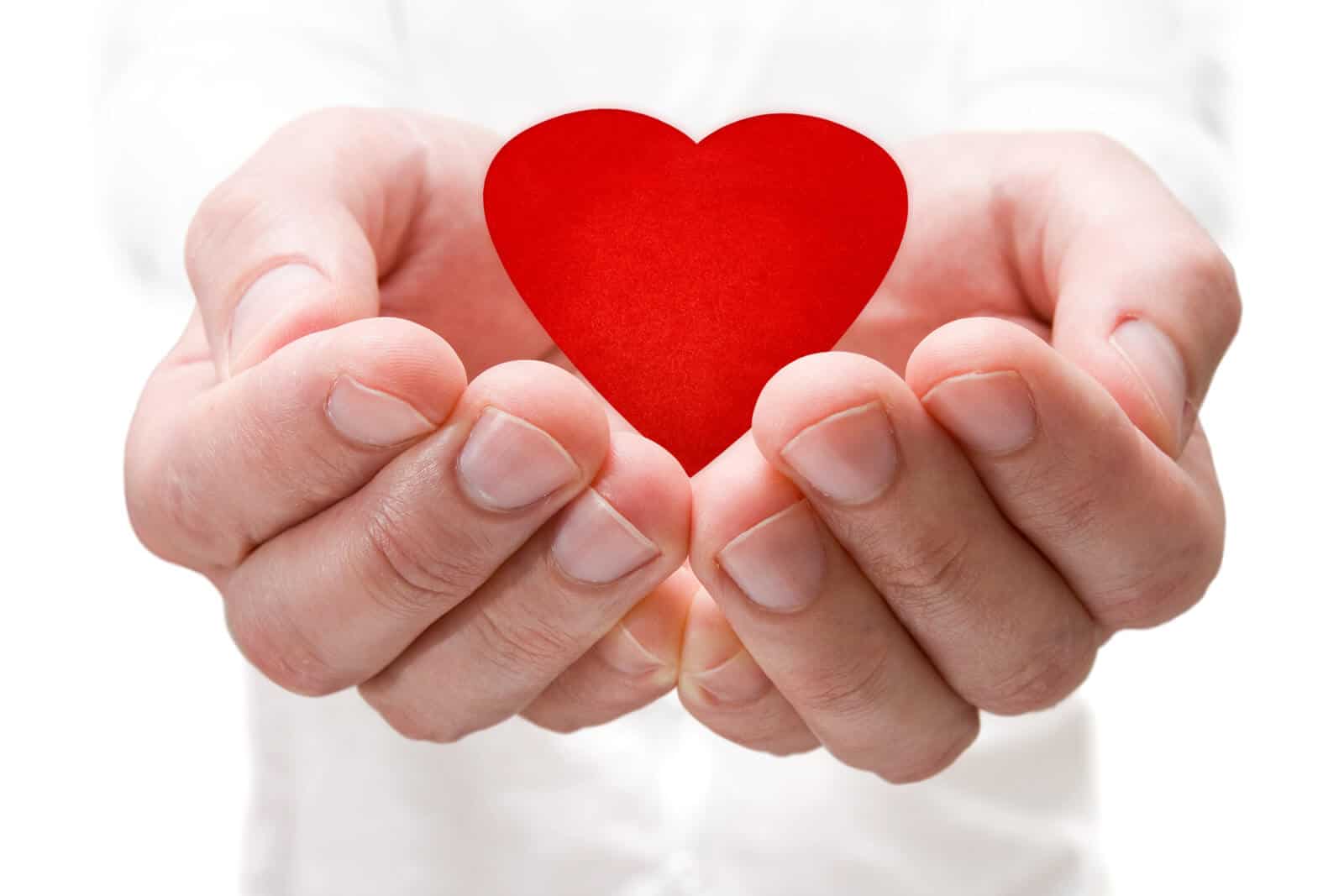 Cupped Hands Holding Red Heart
