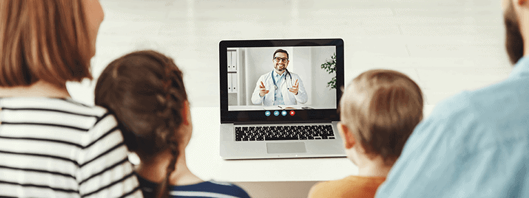 Family Watching a Physician Speaking on Laptop